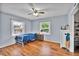 This cozy bedroom offers hardwood floors and plenty of natural light from two windows at 1941 Jungle Rd, New Smyrna Beach, FL 32168