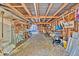 Cluttered interior of detached garage for storage with various supplies at 1941 Jungle Rd, New Smyrna Beach, FL 32168