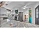 Bright kitchen features stainless appliances, granite countertops, and white cabinetry at 1941 Jungle Rd, New Smyrna Beach, FL 32168