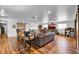 Open living room with hardwood floors, neutral color palette, and abundant natural light at 1941 Jungle Rd, New Smyrna Beach, FL 32168