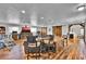 Expansive living room with hardwood floors, modern lighting, and rustic barn doors at 1941 Jungle Rd, New Smyrna Beach, FL 32168