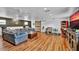 Inviting living area featuring hardwood floors, neutral walls, and contemporary furnishings at 1941 Jungle Rd, New Smyrna Beach, FL 32168