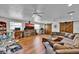 Spacious living area with hardwood flooring, comfortable seating, and modern entertainment center at 1941 Jungle Rd, New Smyrna Beach, FL 32168