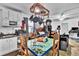 This unique space combines living, dining, and kitchen with a playful blue table at 1941 Jungle Rd, New Smyrna Beach, FL 32168