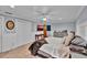 Cozy main bedroom featuring wood-look floors, recessed lighting, and a serene atmosphere at 1941 Jungle Rd, New Smyrna Beach, FL 32168