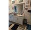 Bathroom with a large mirror, double sinks, and granite countertops at 209 Meghan Cir, Deland, FL 32724