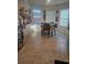 Bright dining area featuring tiled floors, a table and chairs, and multiple windows at 209 Meghan Cir, Deland, FL 32724