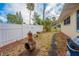 A landscaped backyard with pavers, fire pit and tropical foliage at 219 Lynnhurst Dr, Ormond Beach, FL 32176