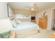 Well-lit bedroom with ceiling fan, window and dresser at 219 Lynnhurst Dr, Ormond Beach, FL 32176