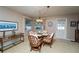 Cozy dining room with a unique light fixture and seating for four at 219 Lynnhurst Dr, Ormond Beach, FL 32176