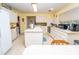 Bright kitchen featuring white cabinetry and countertops, with modern appliances and decor at 219 Lynnhurst Dr, Ormond Beach, FL 32176