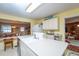 Bright, open kitchen with ample counter space, and an open view into the living area at 219 Lynnhurst Dr, Ormond Beach, FL 32176
