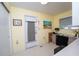 Functional office space with natural light, a door to the outside, and a desk at 219 Lynnhurst Dr, Ormond Beach, FL 32176