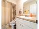 Bathroom featuring shower, toilet, sink and vanity and with neutral colored walls at 2309 6Th Ave, Deland, FL 32724
