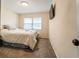 Cozy bedroom with soft carpet and a window for natural light plus a wall-mounted flat screen television at 2309 6Th Ave, Deland, FL 32724