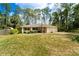 Charming single story home with a manicured lawn, mature landscaping and a two car garage in a wooded setting at 2309 6Th Ave, Deland, FL 32724