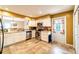 Clean kitchen with white cabinets, stainless steel appliances, and view to the dining room at 2309 6Th Ave, Deland, FL 32724