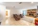 Spacious living room with tile floors, brick fireplace, and comfortable seating at 2309 6Th Ave, Deland, FL 32724