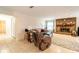 Bright living room with tile floors, brick fireplace, comfortable seating and doorway to bathroom at 2309 6Th Ave, Deland, FL 32724