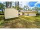 A well-maintained yard features grass and a storage shed at 2309 6Th Ave, Deland, FL 32724