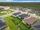 An aerial view showcases the home's placement within a community with green spaces and playgrounds at 234 Mosaic Blvd, Daytona Beach, FL 32124
