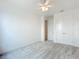 Bright bedroom featuring plush carpet, closet, neutral walls, a ceiling fan, and ample natural light at 234 Mosaic Blvd, Daytona Beach, FL 32124