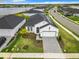 Beautiful single-story home with a well-manicured lawn, gray brick driveway, and solar panels at 234 Mosaic Blvd, Daytona Beach, FL 32124