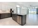 Open kitchen with granite countertops, stainless appliances, and easy access to living area at 234 Mosaic Blvd, Daytona Beach, FL 32124