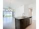 Modern kitchen island with a stainless dishwasher and easy access to open concept living space at 234 Mosaic Blvd, Daytona Beach, FL 32124