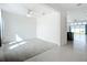 Large, carpeted living room space with great lighting, open floor plan, and neutral wall colors at 234 Mosaic Blvd, Daytona Beach, FL 32124