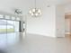 Bright, open living area with tile floors, high ceilings, and an abundance of natural light at 234 Mosaic Blvd, Daytona Beach, FL 32124