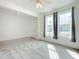 Carpeted living room with bright windows, a ceiling fan, and a light and airy feel at 234 Mosaic Blvd, Daytona Beach, FL 32124