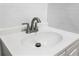 Close-up of the bathroom sink and faucet featuring white subway tiles at 2524 Anastasia Dr, South Daytona, FL 32119