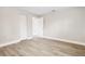 Bedroom with a closet, neutral colors, and wood-look floors at 2524 Anastasia Dr, South Daytona, FL 32119