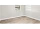 Simple bedroom featuring durable floors, neutral paint, white trim and a window offering natural light at 2524 Anastasia Dr, South Daytona, FL 32119