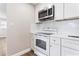 Bright, updated kitchen featuring modern appliances, white cabinetry, and sleek countertops at 2524 Anastasia Dr, South Daytona, FL 32119
