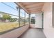 Relaxing screened porch with ample light, offering an outdoor retreat in a cozy home setting at 2524 Anastasia Dr, South Daytona, FL 32119