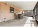 Enclosed sunroom with tile floor, table and chairs at 2524 Anastasia Dr, South Daytona, FL 32119