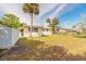 Spacious backyard with shed and mature trees creating a serene outdoor space at 2605 Fairmont Ave, New Smyrna Beach, FL 32168