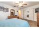 Bright bedroom with a spacious closet, warm carpet, and a view into the hallway at 2605 Fairmont Ave, New Smyrna Beach, FL 32168