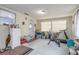 Bonus room provides extra space for exercise equipment, storage, and other activities, with natural light from multiple windows at 2605 Fairmont Ave, New Smyrna Beach, FL 32168