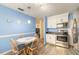 Open concept kitchen with stainless steel appliances, a breakfast nook, and light blue painted walls at 2605 Fairmont Ave, New Smyrna Beach, FL 32168