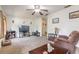 Inviting living room featuring neutral carpet, ceiling fan and a relaxing atmosphere at 2605 Fairmont Ave, New Smyrna Beach, FL 32168