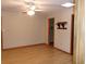 Bedroom with laminate floors, ceiling fan and light, and built in display shelf at 26225 Troon Ave, Mount Plymouth, FL 32776