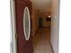 Home entryway showcasing tile flooring and an arched doorway leading into the living space at 26225 Troon Ave, Mount Plymouth, FL 32776
