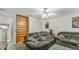 Cozy living room with plush seating and built-in shelving perfect for a relaxing night in at 2625 Sweet Springs St, Deltona, FL 32738