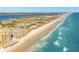 Scenic aerial capturing oceanfront condos next to the beach, offering unparalleled coastal living at 2855 S Atlantic Ave # 303, Daytona Beach Shores, FL 32118