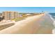 Aerial view of beachfront condominium with a beautiful beach at 2855 S Atlantic Ave # 303, Daytona Beach Shores, FL 32118