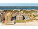 Beautiful aerial of two condos and a neighborhood between the ocean and a lake with stunning views at 2855 S Atlantic Ave # 303, Daytona Beach Shores, FL 32118