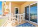 Relaxing balcony with table set and ocean views at 2855 S Atlantic Ave # 303, Daytona Beach Shores, FL 32118